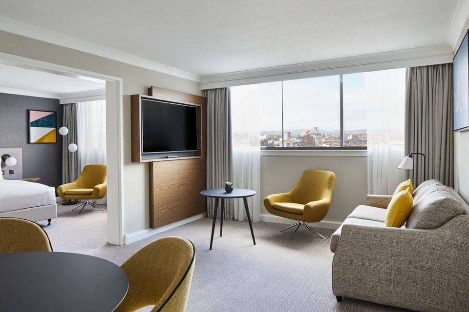 Executive Suite, 1 Bedroom | Living area | 49-inch flat-screen TV with satellite channels, TV