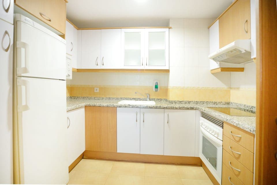 Full-size fridge, microwave, cookware/dishes/utensils