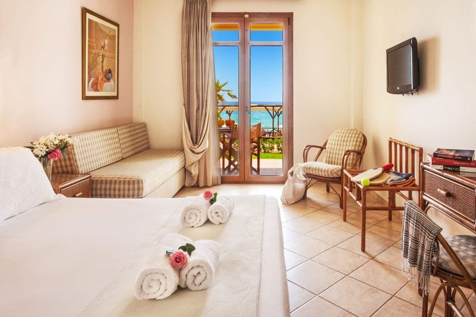 Double Room, Patio, Sea View | In-room safe, blackout drapes, iron/ironing board, free WiFi