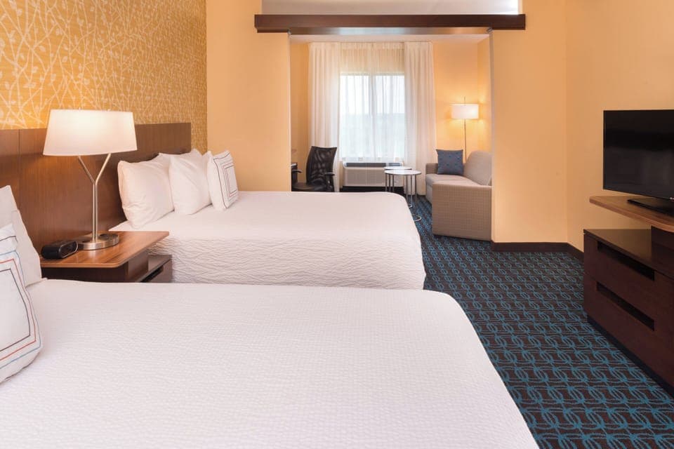 Suite, 2 Queen Beds | Desk, blackout drapes, iron/ironing board, free cribs/infant beds