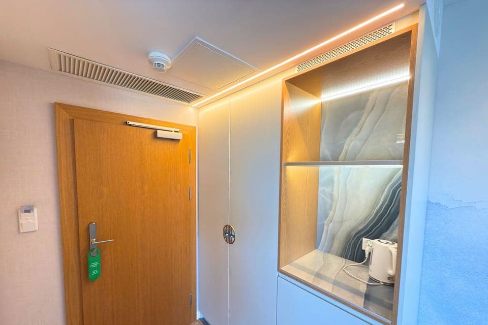 Deluxe Double Room, Partial Sea View | In-room safe, desk, laptop workspace, blackout drapes