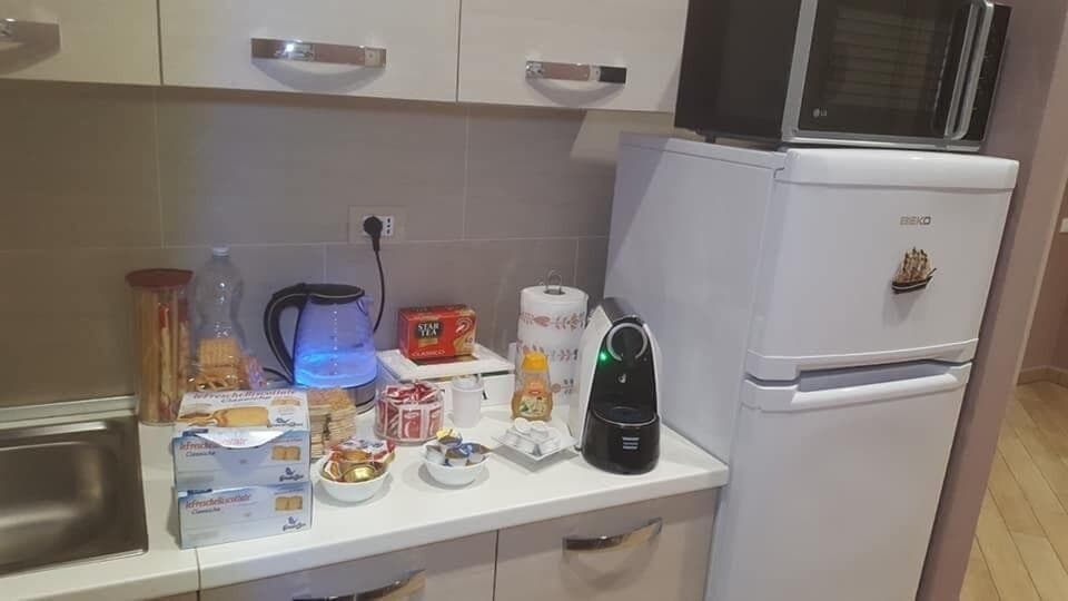 Fridge, electric kettle, cookware/dishes/utensils