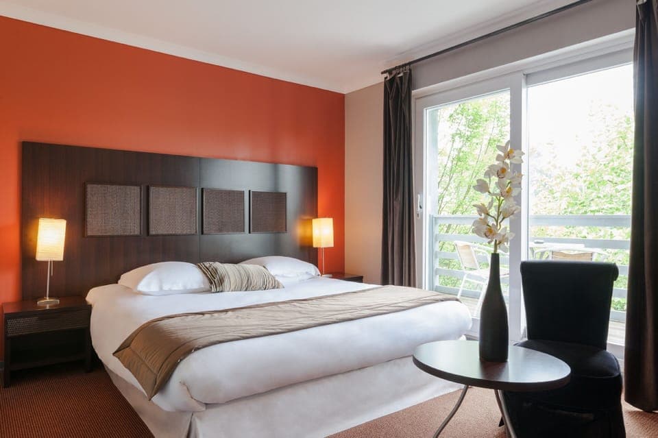 Deluxe Double Room, Courtyard Area | Minibar, in-room safe, individually decorated, soundproofing