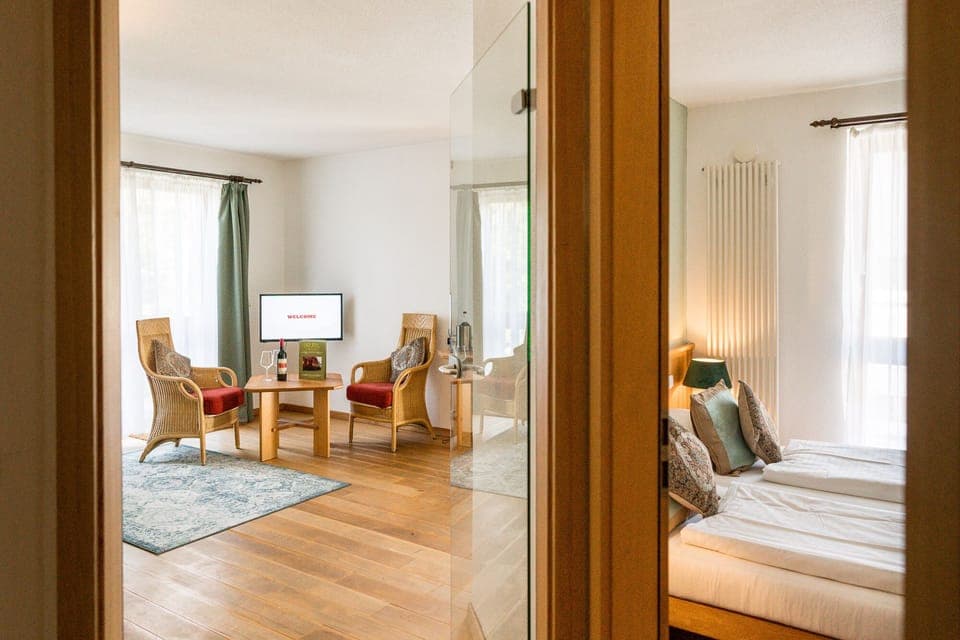 Suite, Balcony, Garden Area | Living area | Flat-screen TV