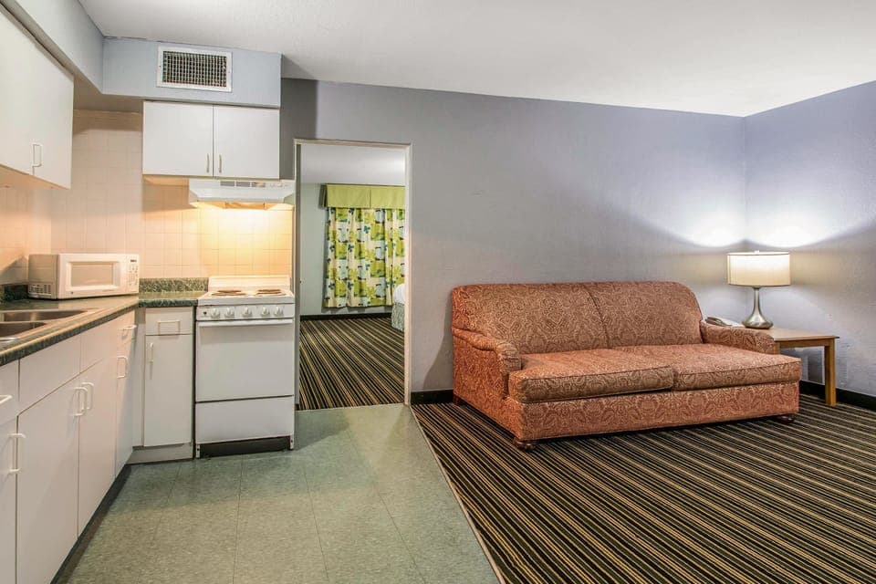 Suite, 1 King Bed, Non Smoking | Desk, laptop workspace, iron/ironing board, free WiFi