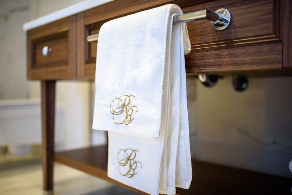 Bathtub, designer toiletries, hair dryer, bathrobes