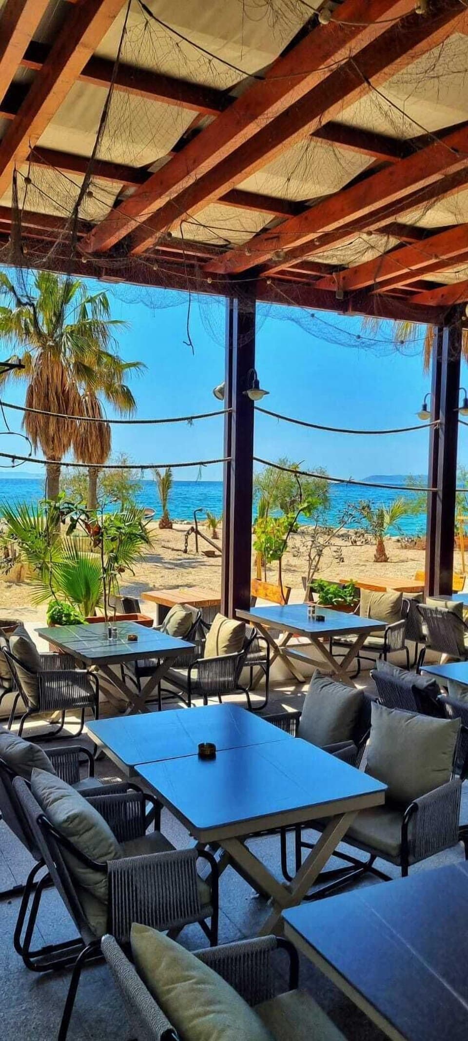 Breakfast, lunch, dinner served; Mediterranean cuisine, beach views 