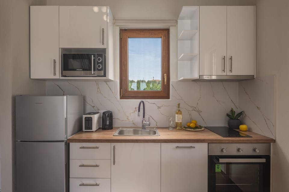 Family Villa, 2 Bedrooms, Private Pool, Pool View | Private kitchen | Full-size fridge, microwave, oven, stovetop