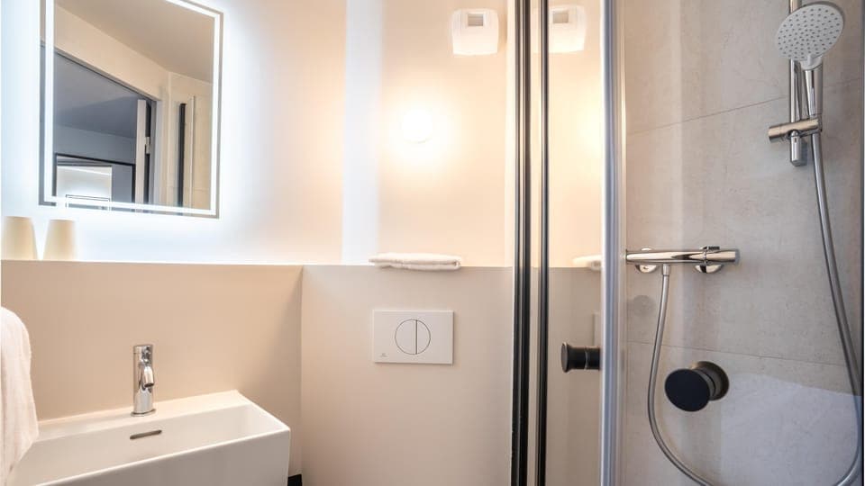 Shower, eco-friendly toiletries, towels, soap