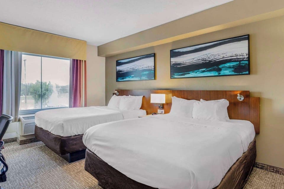 Suite, 2 Queen Beds & Sofa Bed, Non-Smoking | Down comforters, desk, laptop workspace, blackout drapes