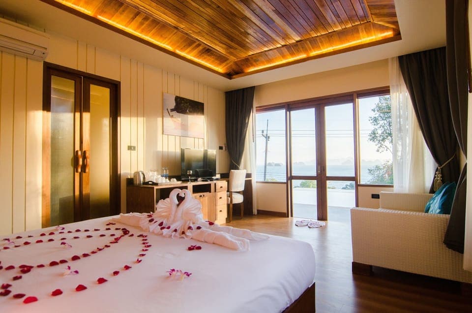 Deluxe Ocean View Grand Pool Villa | Minibar, in-room safe, desk, blackout drapes