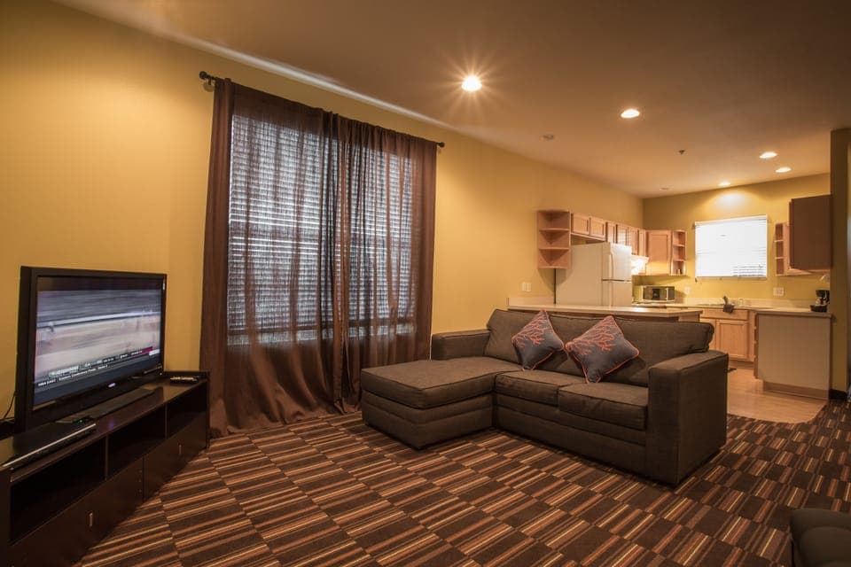 Suite, 1 King Bed with Sofa bed | Living area | 36-inch TV with cable channels, DVD player