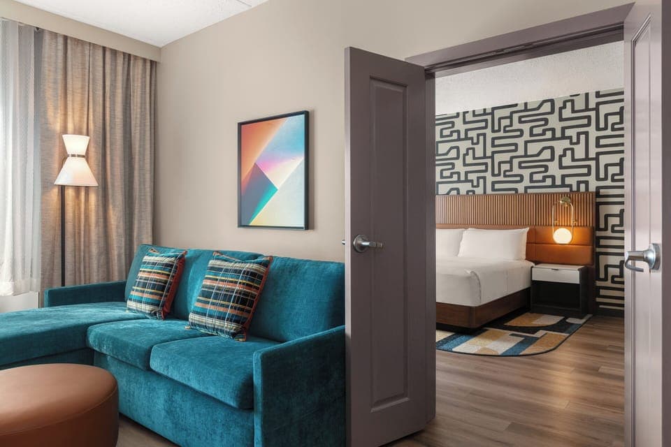 Suite, 1 Bedroom (with Living Area) | In-room safe, desk, blackout drapes, iron/ironing board