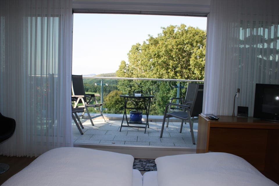 Comfort Triple Room, Balcony | In-room safe, desk, soundproofing, free cribs/infant beds