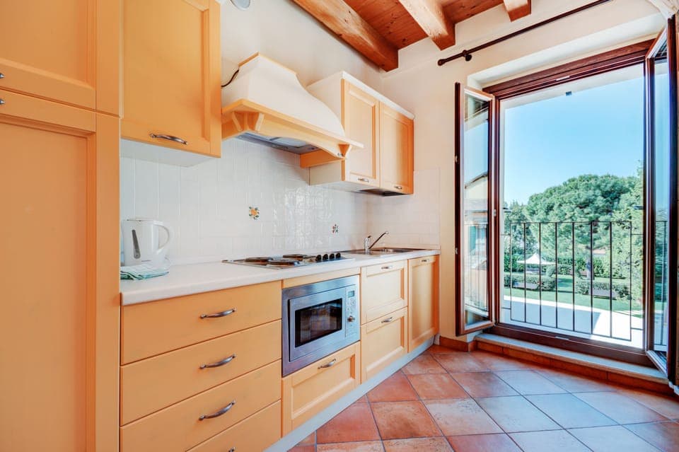 Fridge, coffee/tea maker, electric kettle, cookware/dishes/utensils