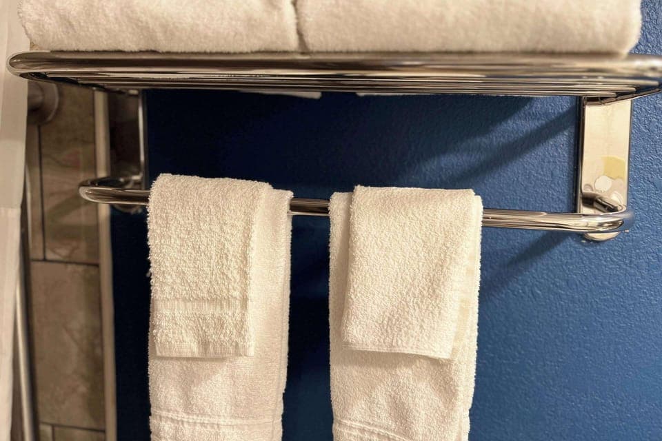 Desk, laptop workspace, iron/ironing board, cribs/infant beds