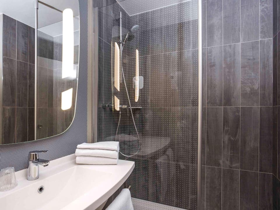 Premium bedding, desk, laptop workspace, iron/ironing board