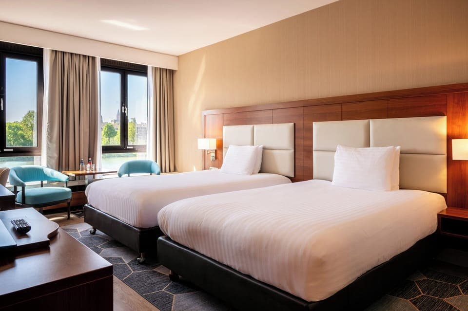 Premium Room, 2 Queen Beds, River View (River Meuse View) | Minibar, in-room safe, desk, laptop workspace