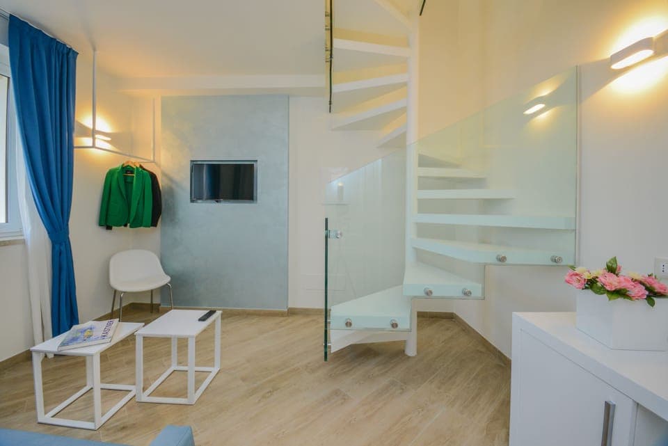 Panoramic Suite, 1 Queen Bed, Lake View, Tower | Living room | Flat-screen TV