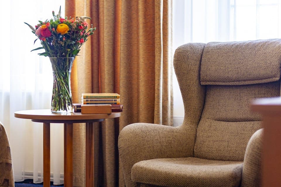 Desk, laptop workspace, blackout drapes, iron/ironing board