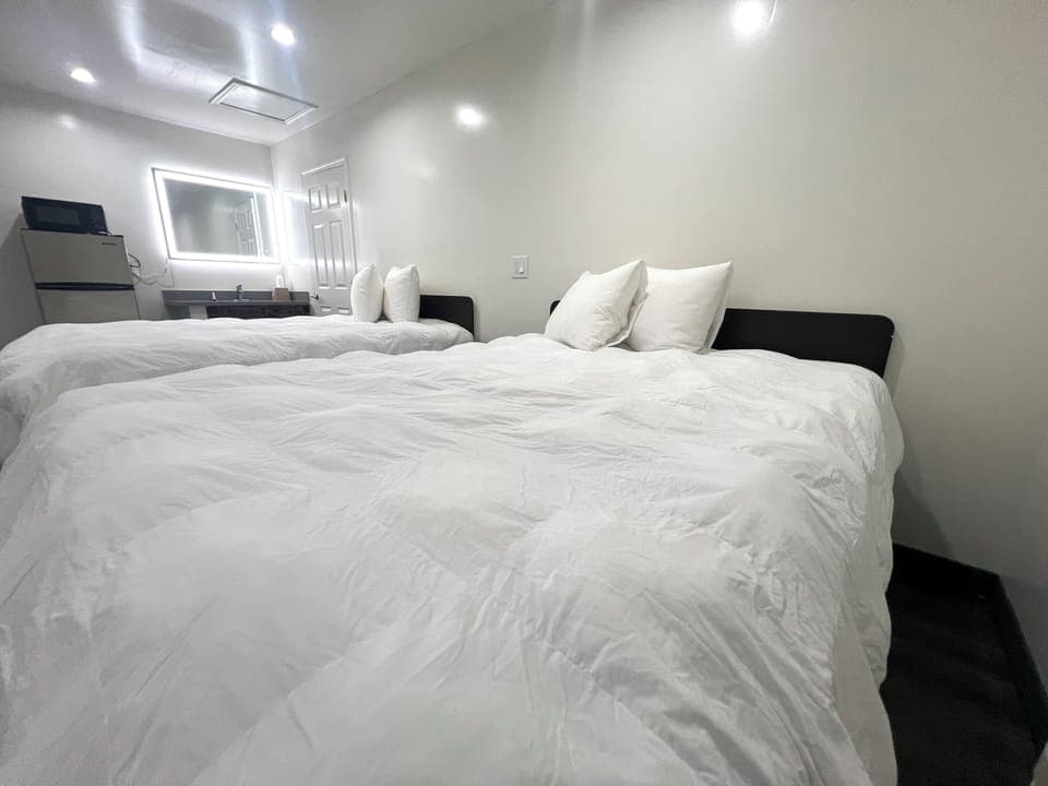 Deluxe Room, 2 Queen Beds, Non Smoking | Iron/ironing board, bed sheets