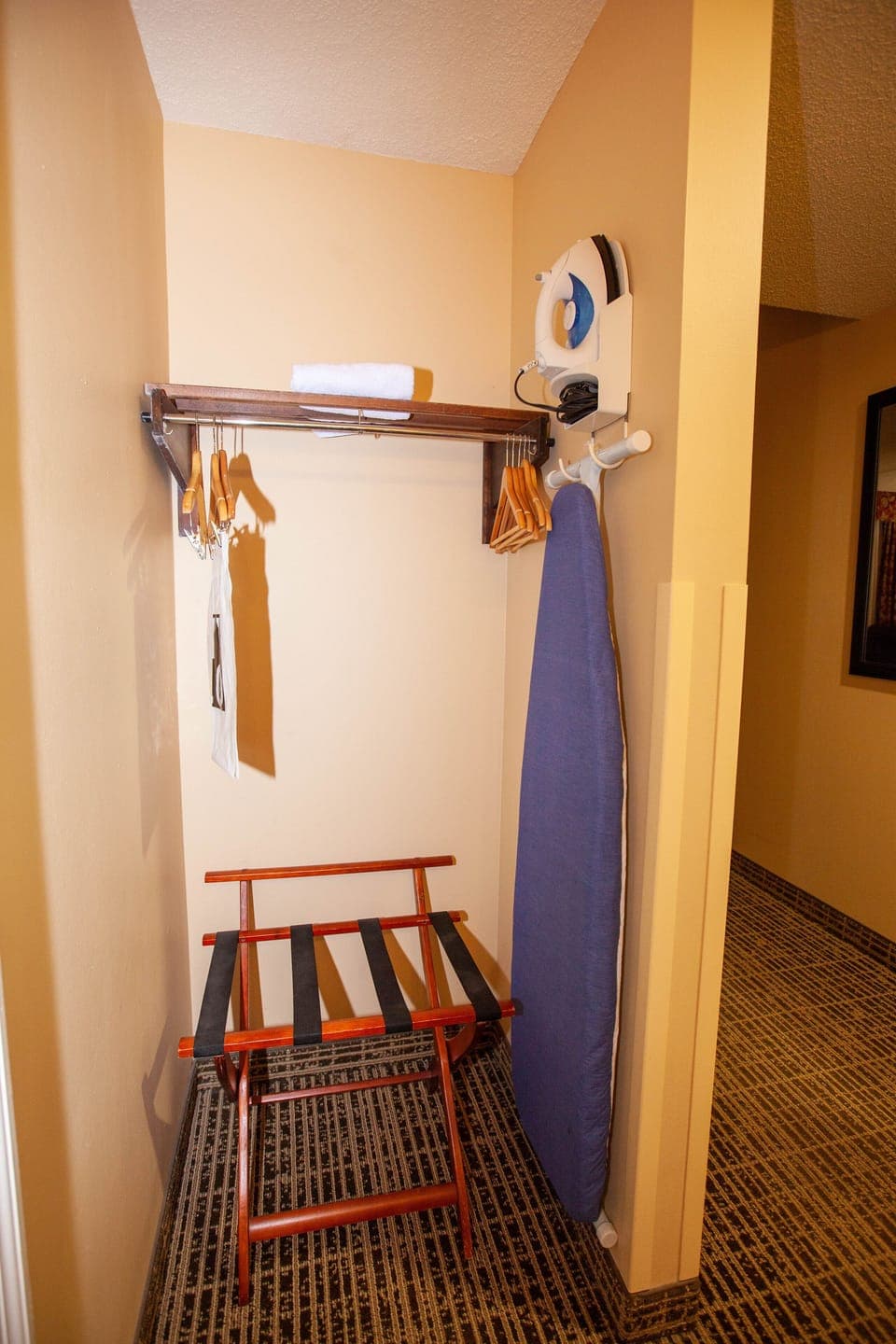 Desk, laptop workspace, iron/ironing board, free cribs/infant beds