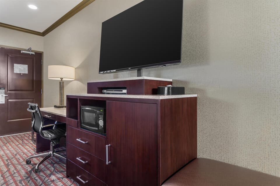 Premium bedding, desk, laptop workspace, iron/ironing board