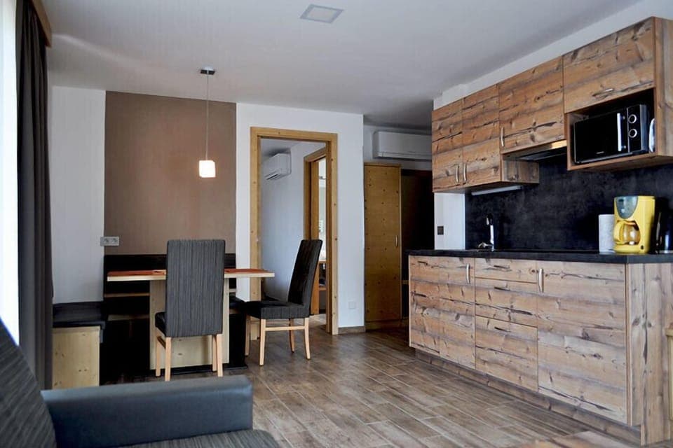 Apartment, 2 Bedrooms, Balcony | Living area | Flat-screen TV