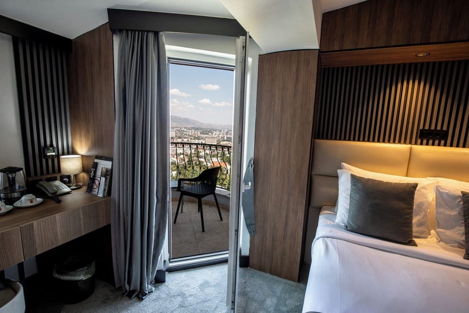 Deluxe Double Room, 1 Queen Bed, Balcony, City View | Premium bedding, minibar, desk, blackout drapes