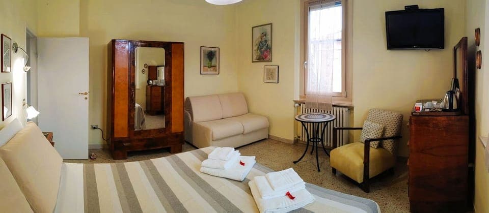 Family Triple Room | Minibar, in-room safe, blackout drapes, soundproofing