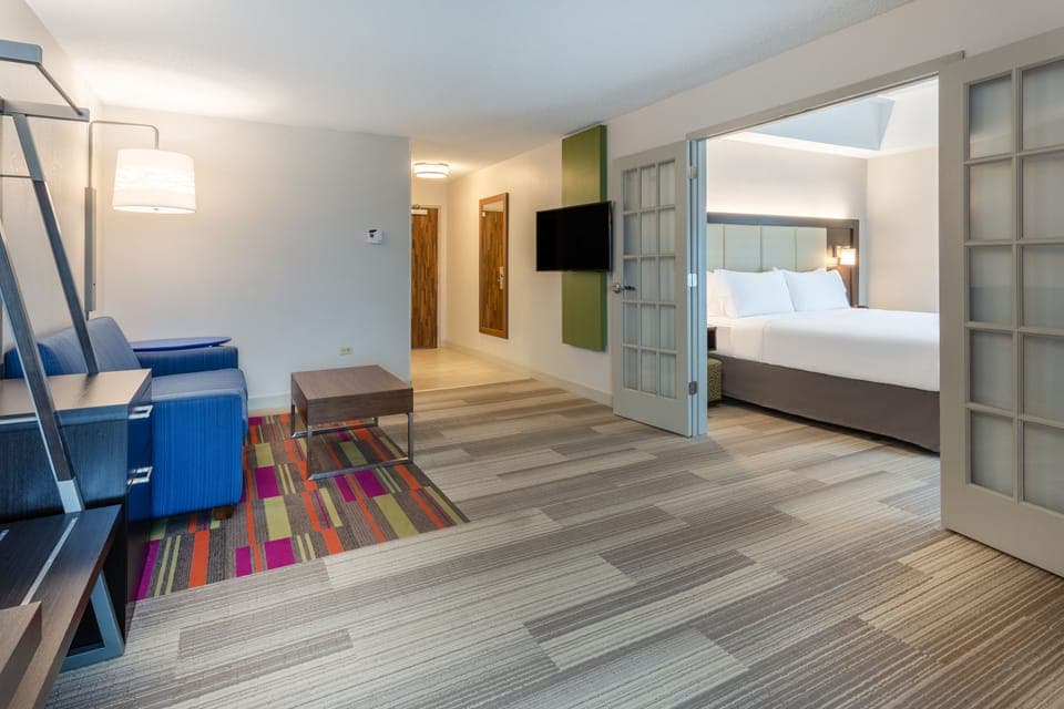 Suite, 1 King Bed | In-room safe, desk, iron/ironing board, free cribs/infant beds