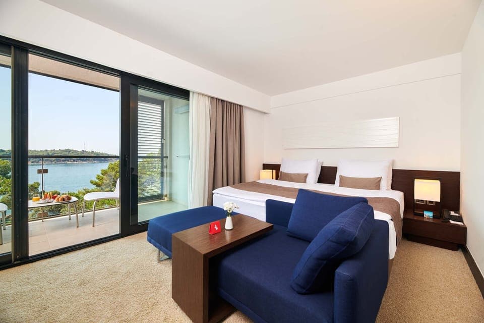 Premium Room, Balcony, Sea View | Minibar, in-room safe, desk, blackout drapes