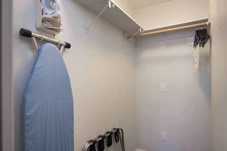 Premium bedding, desk, laptop workspace, iron/ironing board