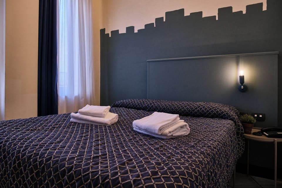 Family Quadruple Room | In-room safe, desk, laptop workspace, blackout drapes