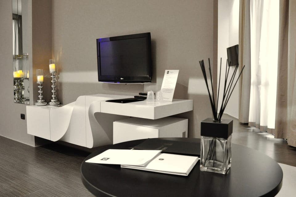 Luxury Suite, 1 Bedroom, Balcony | Living area | Flat-screen TV, first-run movies