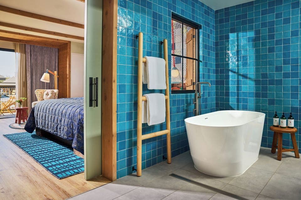 Designer toiletries, hair dryer, bathrobes, towels