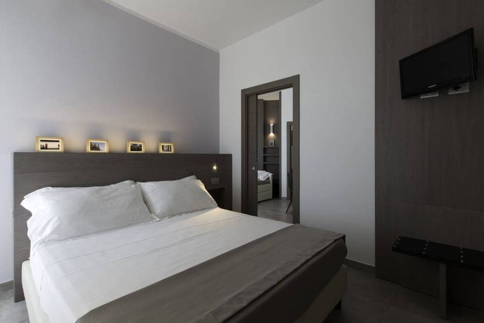 Quadruple Room, 2 Bedrooms | Minibar, in-room safe, desk, free WiFi