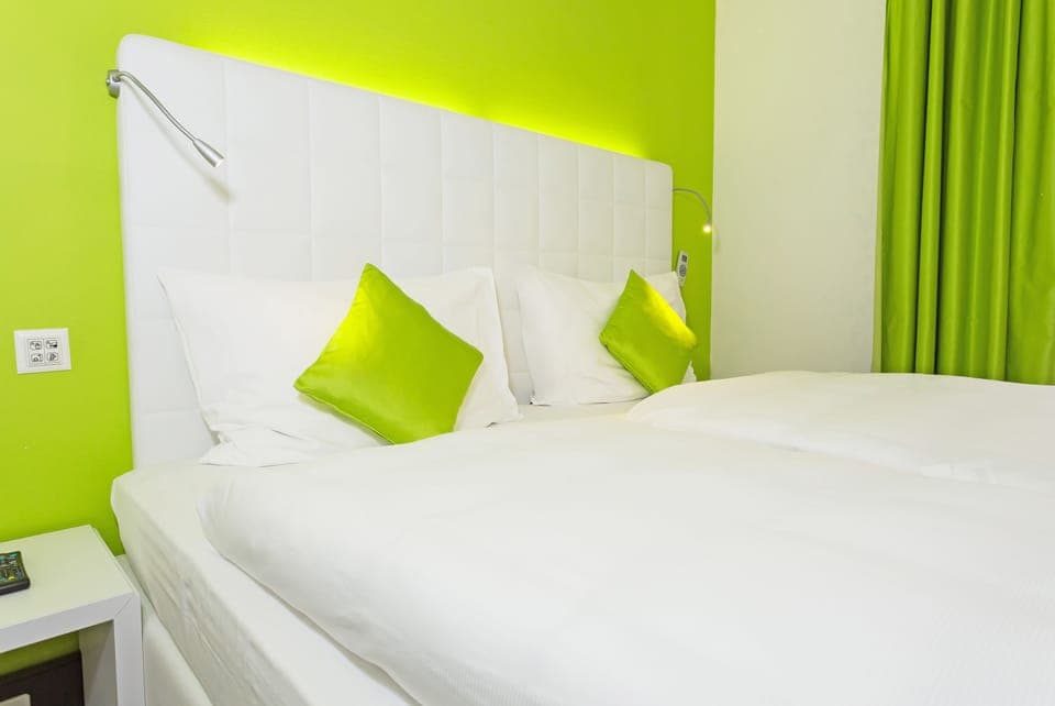 Premium bedding, down comforters, in-room safe, desk