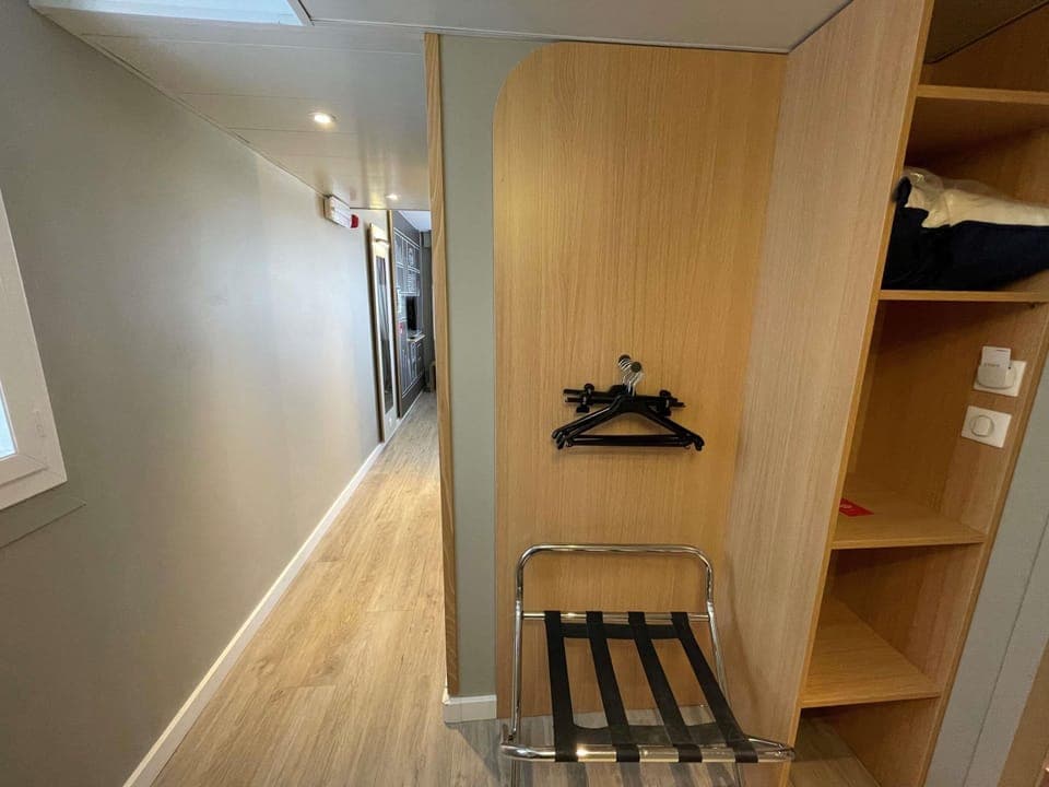 Premium bedding, desk, laptop workspace, blackout drapes