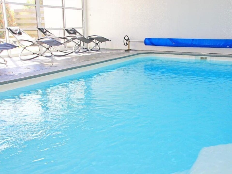 Indoor pool, a heated pool, sun loungers