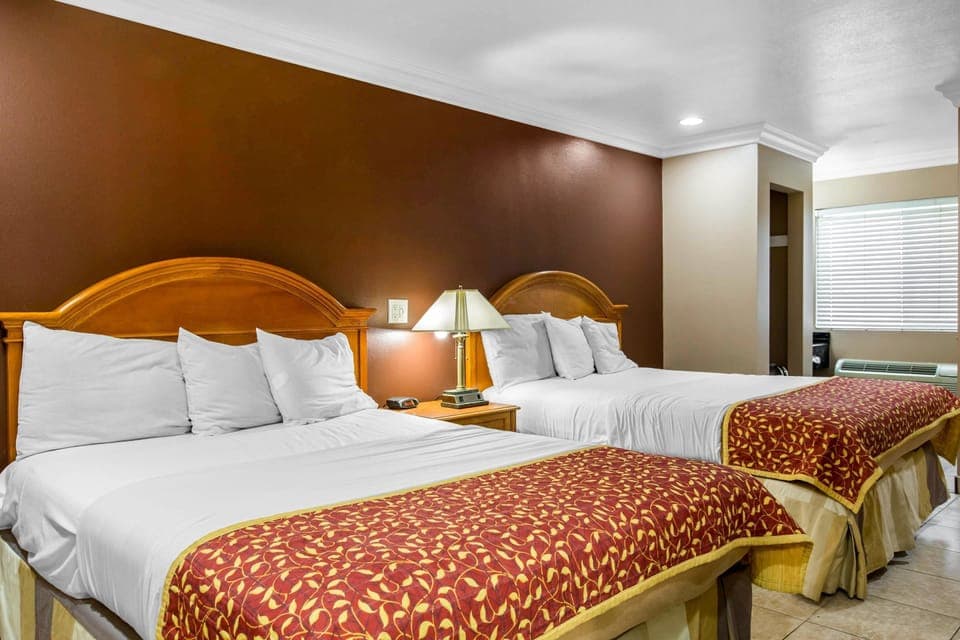 Standard Room, 2 Queen Beds, Non Smoking | Desk, laptop workspace, iron/ironing board, free WiFi