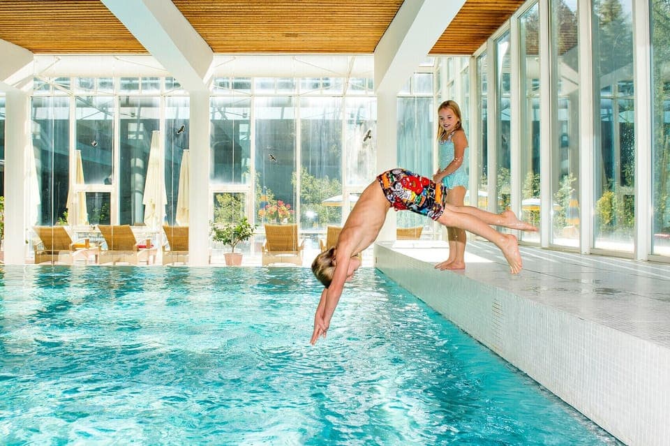 Indoor pool, outdoor pool, pool umbrellas, sun loungers
