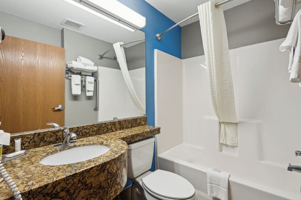 Standard Room, 2 Queen Beds | Bathroom | Combined shower/tub, hair dryer, towels, soap