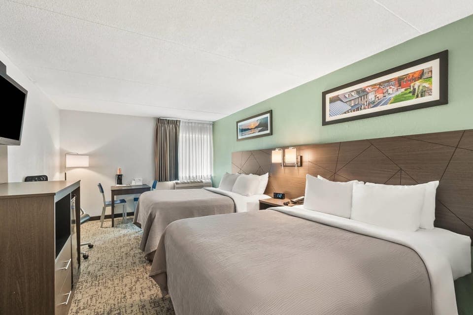 Standard Room, 2 Queen Beds, Non Smoking | Desk, blackout drapes, iron/ironing board, free cribs/infant beds