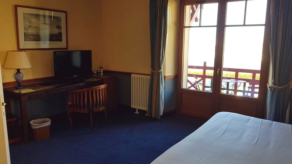 Deluxe Double Room | Minibar, desk, laptop workspace, blackout drapes