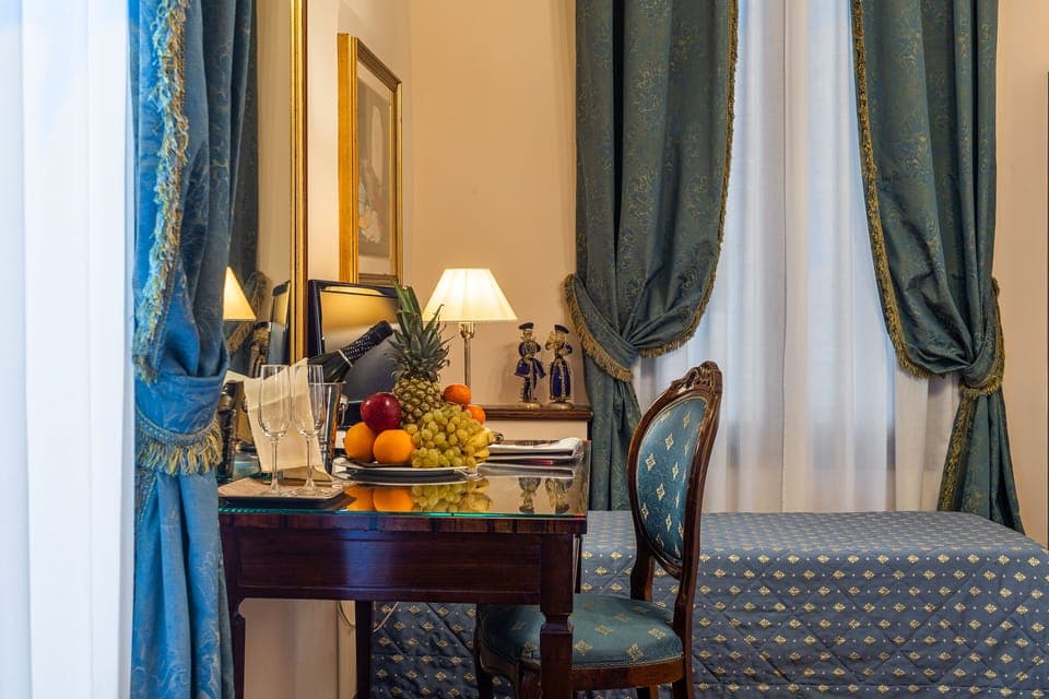 Triple Room | Minibar, in-room safe, desk, soundproofing