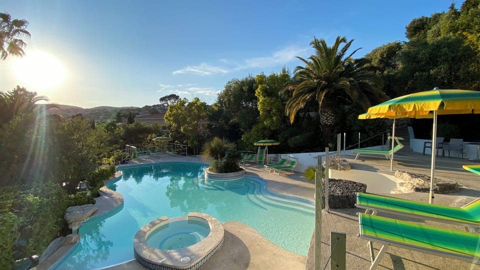 Seasonal outdoor pool, open 9:00 AM to 8:30 PM, pool umbrellas