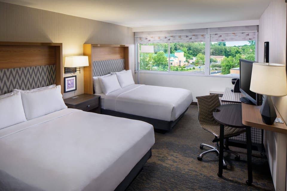 Premium bedding, down comforters, Tempur-Pedic beds, desk