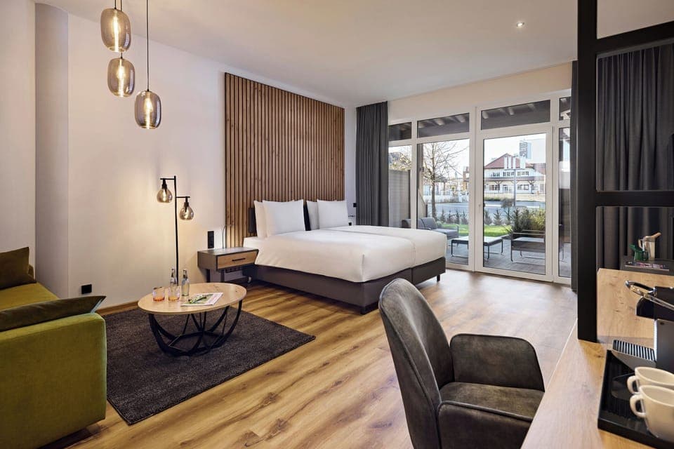 Junior Suite Garden | In-room safe, desk, laptop workspace, blackout drapes