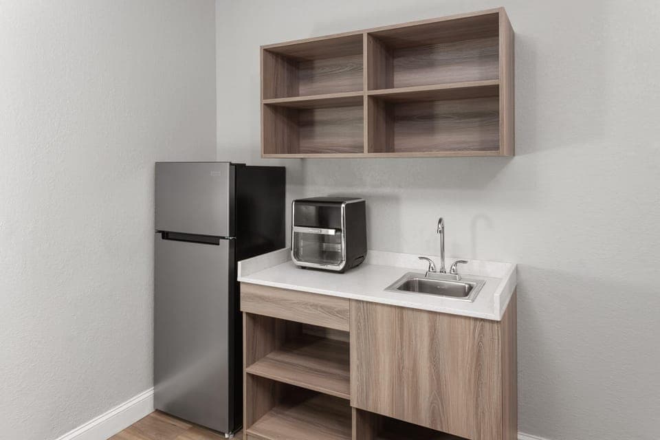 Suite, 1 King Bed, Non Smoking, Kitchenette | Pillowtop beds, desk, laptop workspace, iron/ironing board